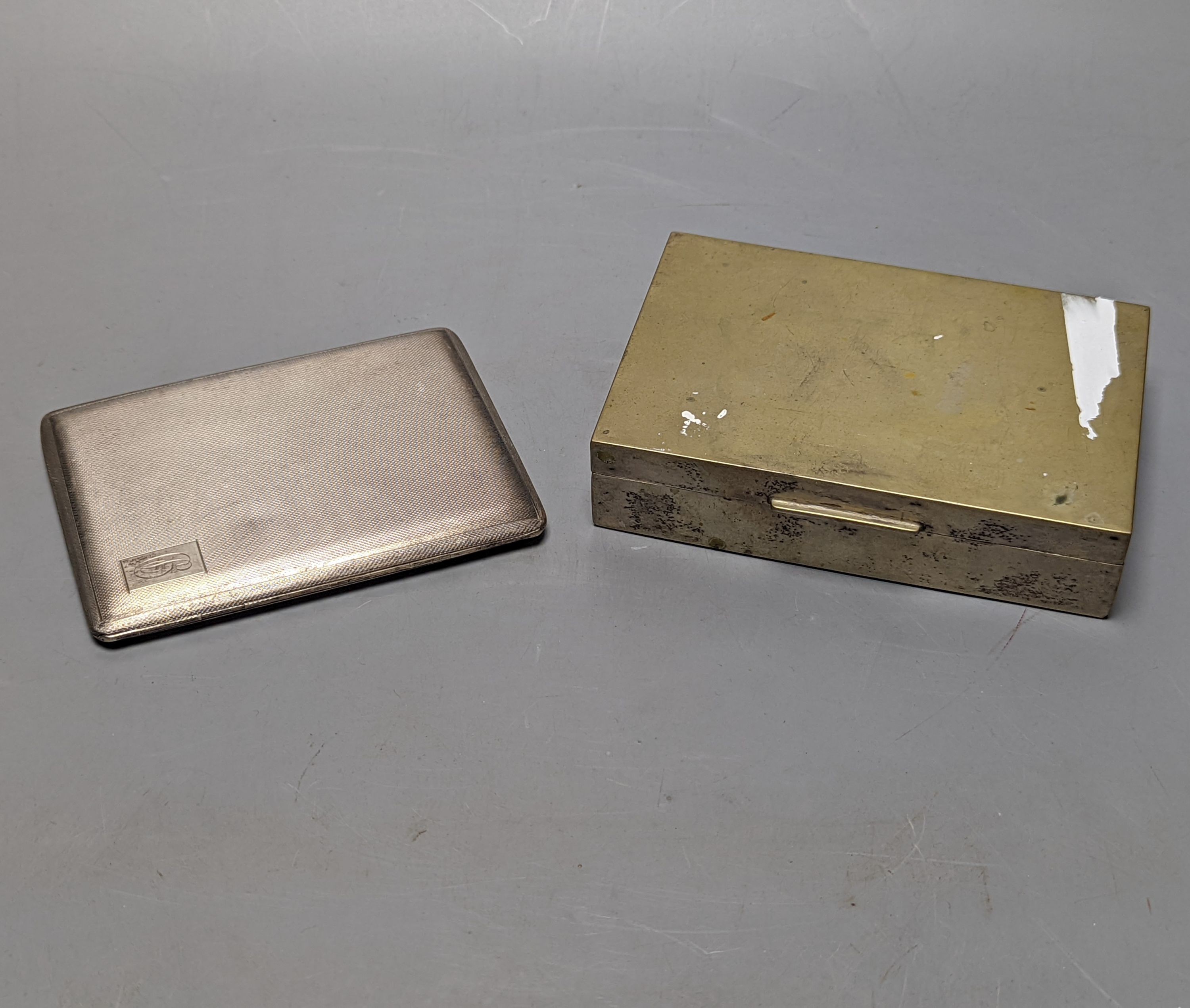 A George V engine turned silver cigarette case, 11.3cm, together with an 800 standard white metal mounted cigarette box.